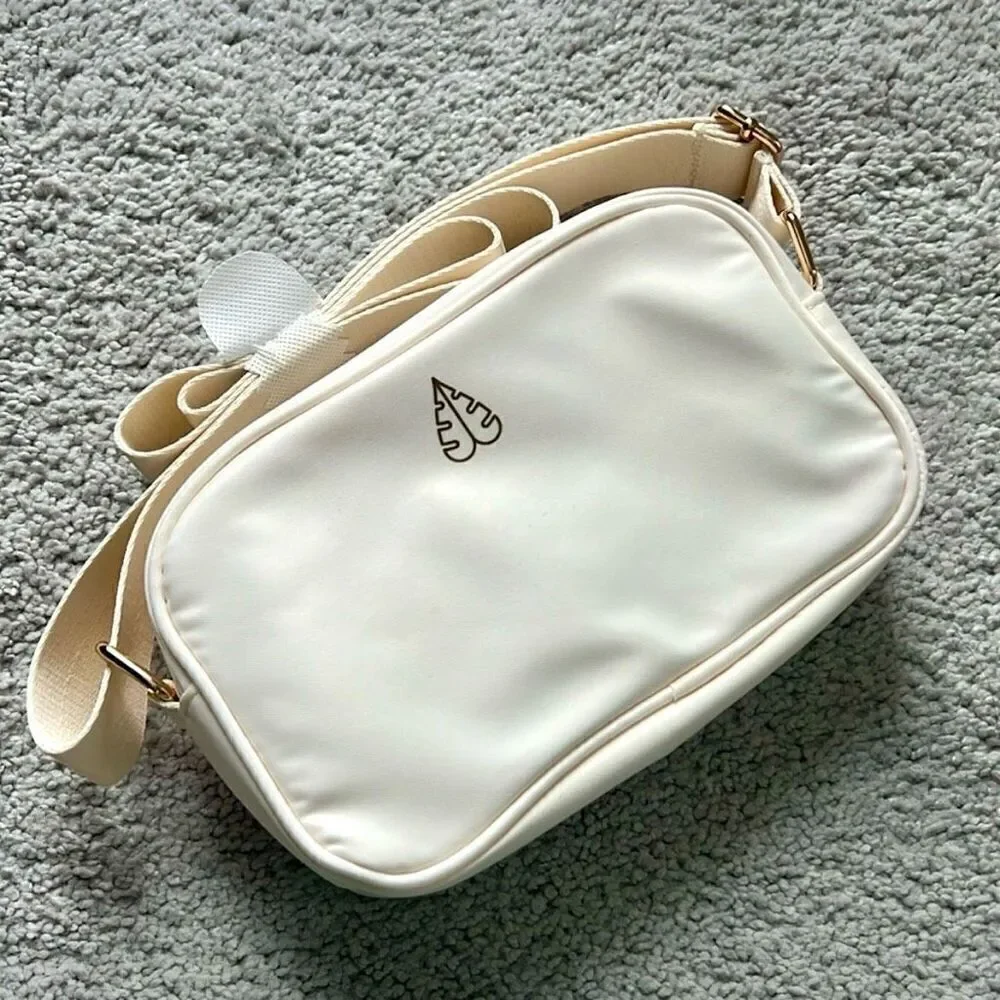 NWT Gorgeous Biossance White/ Ivory Satin Light Cushion adjustable crossbody bag